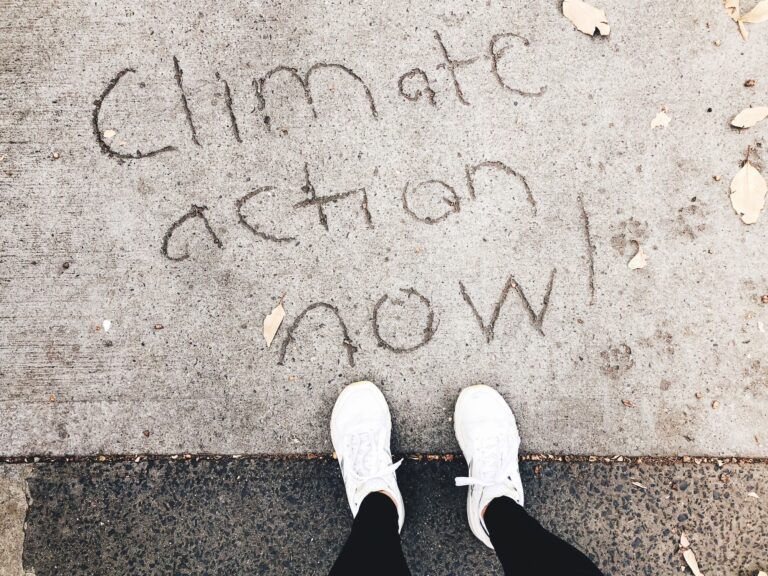 Climate action now writing into he concrete floor