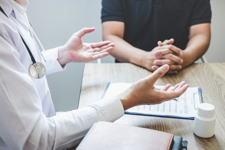 Doctor consulting with patient examining for patient