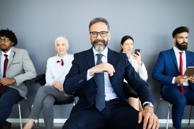 Group of business people with leader at front